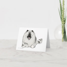 Keeshond met "puppy" kaart