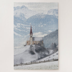Kerk in een alpenwinterlandschap legpuzzel