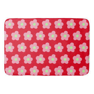 Kersenbloesems op rood badmat
