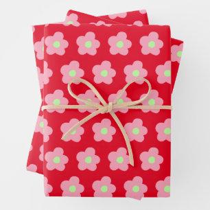 Kersenbloesems op rood inpakpapier vel