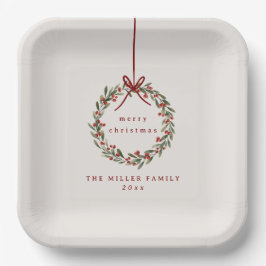 Kerst gebladerte krans met rode boog papieren bordje