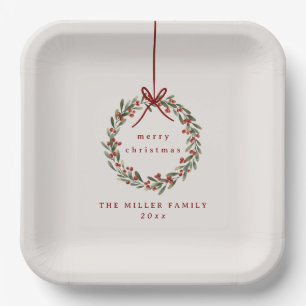 Kerst gebladerte krans met rode boog papieren bordje