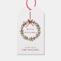 Kerst gebladerte krans met rode strik op wit