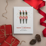 Kerst met de rode en goudkoorts feestdagenkaart<br><div class="desc">Traditionele kerstfeestdag Kaart. Het ontwerp bevat uw gebeurtenisgegevens in serif lettering,  met een waterverf illustratie van drie nutcrackers geadorneerd met faux goudstof. Al tekst is gemakkelijk aan te passen.</div>