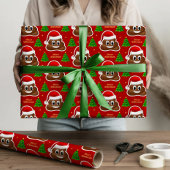 Kerst poep emoji met kerstmuts inpakpapier