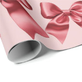 Kerst rode boog op roze achtergrond cadeaupapier (Rol Hoek)