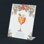 Kerst Signatuur Drink Reclamebord Met Voetstuk<br><div class="desc">Dit kenmerkende drink-menubord heeft een feestelijk kersthulst-maretak-ontwerp. De scriptkoptekst is een afbeelding dat niet kan worden bewerkt. Alle tekst is volledig bewerkbaar. De sjabloon bevat meer dan 100 drink mogelijkheden. Als u het afbeelding van de drink wilt wijzigen, selecteert u de knop "Aanpassen" en klikt u op het oogpictogram op...</div>