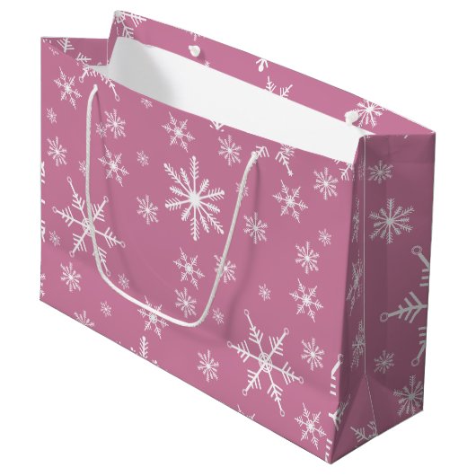 Kerst sneeuwvlok op roze groot cadeauzakje (Voorkant Gekanteld)