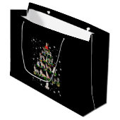 Kerstaire kerstboom, bedekt door vlieglicht groot cadeauzakje (Voorkant Gekanteld)