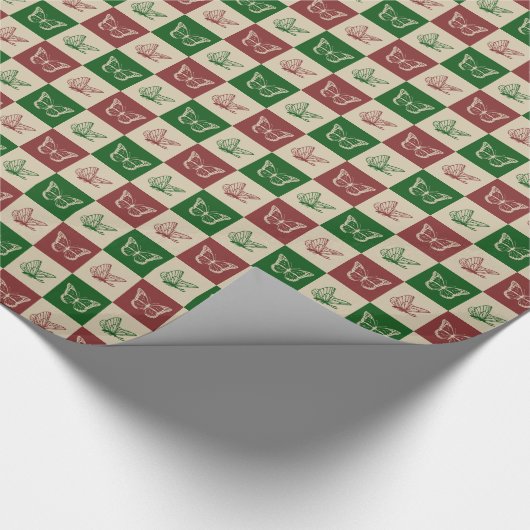 Kerstavond rood en groen vlinderpatroon cadeaupapier (Hoek)