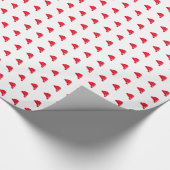 Kerstavond roodwitte kerstcadeau met een kerstcade cadeaupapier (Hoek)