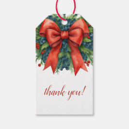 Kerstbabyfeestje met rode strik cadeaulabel