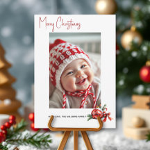 Kerstbal met rode strik en spar foto