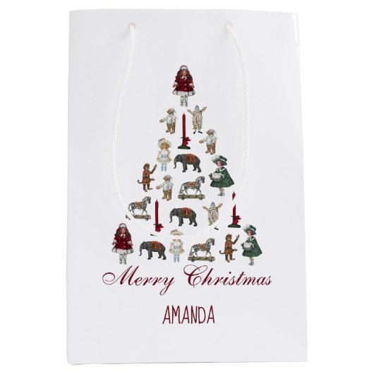 Kerstboom gemaakt van  speelgoed, rood script medium cadeauzakje (Voorkant)