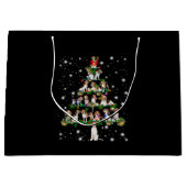 Kerstboom rond de beugel, bedekt door vlieglicht groot cadeauzakje (Voorkant)