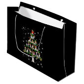 Kerstboom rond de beugel, bedekt door vlieglicht groot cadeauzakje (Voorkant Gekanteld)