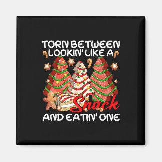 Kerstboom verscheurd tussen eruit zien als een sna magneet