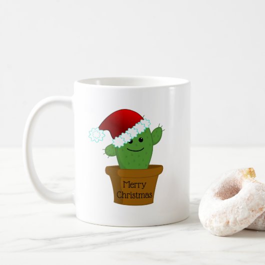 Kerstcactus in een kerstmuts koffiemok (Met donut)