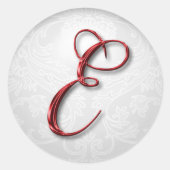 kerstcadeau sticker rood monogram (Voorkant)