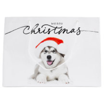 KERSTCADEAUZAK MET HUSKY PUPPY IN SANTA HAT