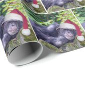 Kerstchimpansee met een kerstmuts cadeaupapier (Rol Hoek)