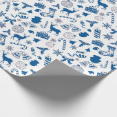 kerstdecoratie in blauw op wit cadeaupapier (Hoek)