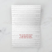 Kerstdennen met rood lint op muziek kaart (Binnen)