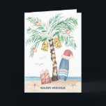 Kersteiland Palm Surf Santa Tropical Beach Feestdagen Kaart<br><div class="desc">De kerstkaart voor het beach-thema bevat een palmboom met kerstboom (versierd met ornamenten en lichten) op een tropisch eiland met een kerstman die op een surfbord, een cadeau, zeesterren, oceaangolven, zee vogels en een "Warm Wishes" vakantiegroet staat. De groet en de naam binnen kunnen worden gepersonaliseerd. Art door KL Stock...</div>