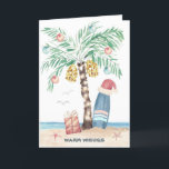 Kersteiland Palm Surf Santa Tropical Beach Feestdagen Kaart<br><div class="desc">De kerstkaart voor het beach-thema bevat een palmboom met kerstboom (versierd met ornamenten en lichten) op een tropisch eiland met een kerstman die op een surfbord, een cadeau, zeesterren, oceaangolven, zee vogels en een "Warm Wishes" vakantiegroet staat. De groet en de naam binnen kunnen worden gepersonaliseerd. Art door KL Stock...</div>