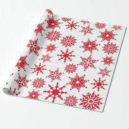 Kerstfeestjes, witte en rode sneeuwvlokken cadeaupapier