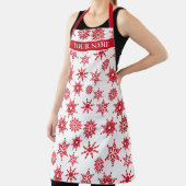 Kerstfeestjes, witte en rode sneeuwvlokken schort (Insitu)