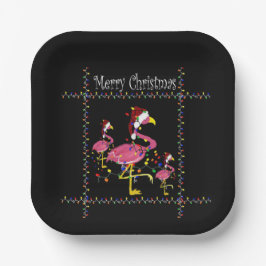 Kerstflamingo's met vakantielichten op zwart papieren bordje