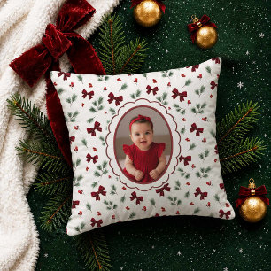 Kerstfoto met rode strik kussen