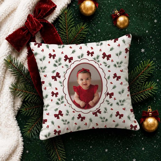 Kerstfoto met rode strik kussen
