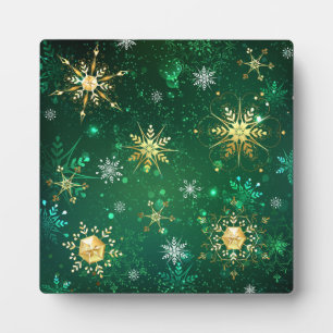 Kerstgouden sneeuwvlokken op groene achtergrond fotoplaat