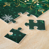 Kerstgouden sneeuwvlokken op groene achtergrond legpuzzel (Zijkant)