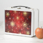 Kerstgouden sneeuwvlokken op rode achtergrond (In situ)