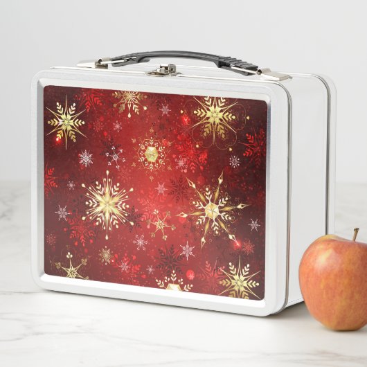 Kerstgouden sneeuwvlokken op rode achtergrond (In situ)