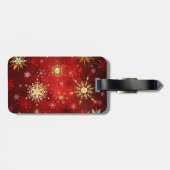 Kerstgouden sneeuwvlokken op rode achtergrond bagagelabel (Achterkant horizontaal)
