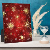 Kerstgouden sneeuwvlokken op rode achtergrond fotoplaat (Zijkant)