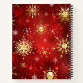 Kerstgouden sneeuwvlokken op rode achtergrond notitieboek (Achterkant)