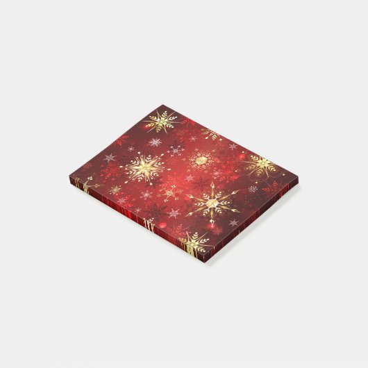 Kerstgouden sneeuwvlokken op rode achtergrond post-it® notes (Schuin)