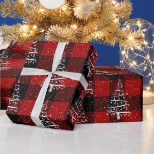 Kersthonkbal en rode sokboom op tast cadeaupapier