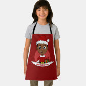 Kerstjongen met een rood pet pron schort (Insitu)