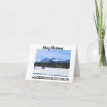 Kerstkaart met besneeuwde bergen