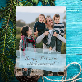 Kerstkaart met blauwe waterverfpenseelstreek Foto