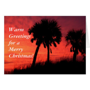 Kerstkaart met palmbomen bij zonsondergang - Op ma