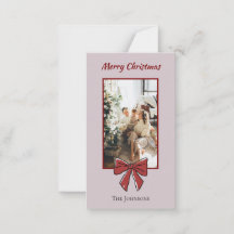 Kerstkaart met rode strik en gepersonaliseerde tek