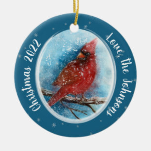 Kerstkardinale sneeuwvlokken op rood of blauw keramisch ornament