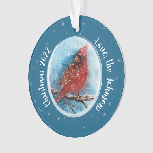 Kerstkardinale sneeuwvlokken op rood of blauw ornament (voorkant)